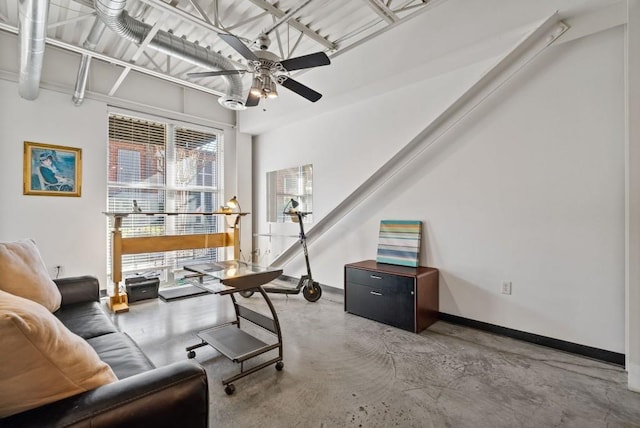 home office with concrete floors and ceiling fan