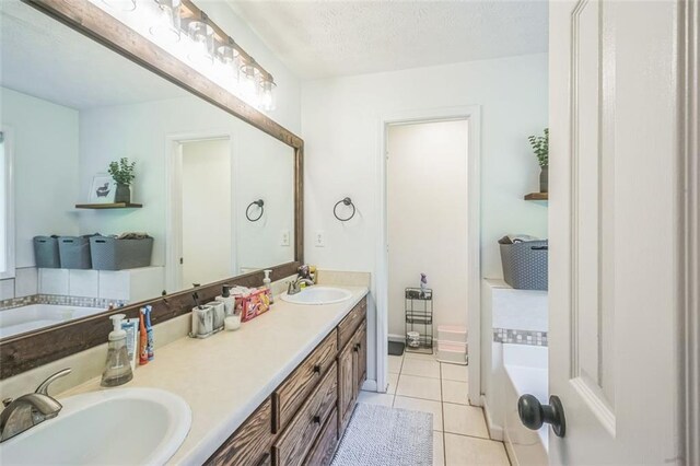 260 Brannon Dr, Hoschton, GA 30548 - bathroom with tile patterned flooring, a bath, and double vanity
