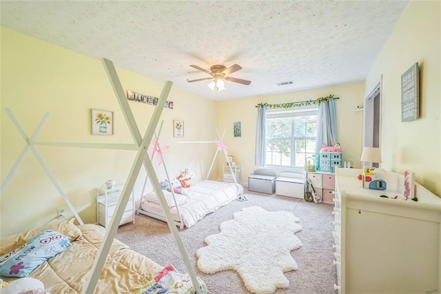 260 Brannon Dr, Hoschton, GA 30548 - carpeted bedroom featuring a textured ceiling and ceiling fan