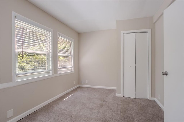 2755 Rockcliff Rd SE, Atlanta, GA 30316 - unfurnished bedroom featuring carpet floors, baseboards, and a closet