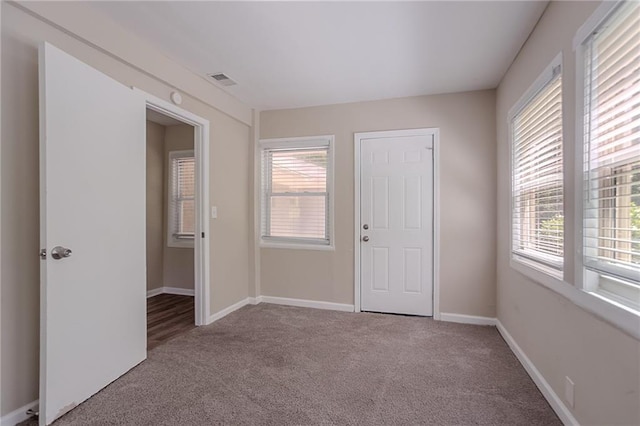 2755 Rockcliff Rd SE, Atlanta, GA 30316 - carpeted spare room featuring healthy amount of natural light and baseboards