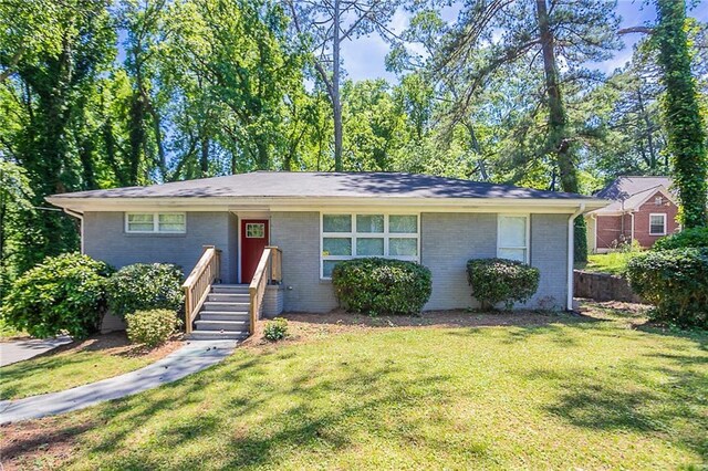 2755 Rockcliff Rd SE, Atlanta, GA 30316 - view of front facade with a front yard and brick siding