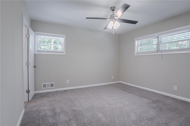 2755 Rockcliff Rd SE, Atlanta, GA 30316 - carpeted spare room featuring plenty of natural light, baseboards, and ceiling fan