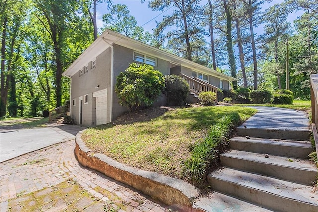 2755 Rockcliff Rd SE, Atlanta, GA 30316 - view of front facade with concrete driveway and stairs