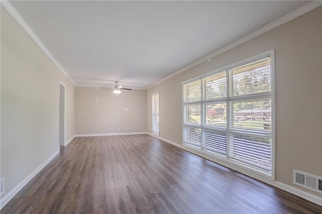 2755 Rockcliff Rd SE, Atlanta, GA 30316 - empty room featuring dark wood-type flooring, ornamental molding, ceiling fan, and baseboards
