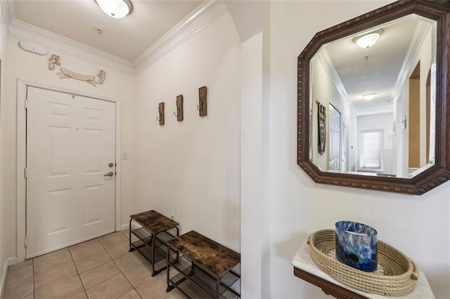 entrance foyer featuring light tile patterned flooring and crown molding