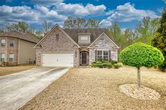 traditional home with central AC unit, driveway, and a front lawn