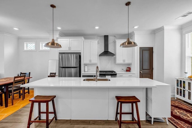 4565 Sims Park Ovlk, Suwanee, GA 30024 - kitchen with appliances with stainless steel finishes, wall chimney range hood, a sink, ornamental molding, and healthy amount of natural light