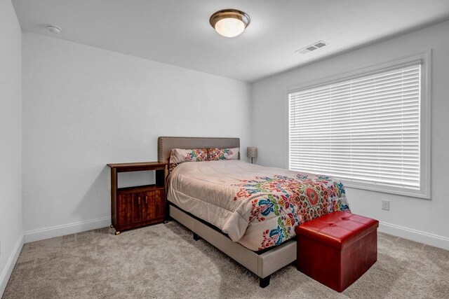 4565 Sims Park Ovlk, Suwanee, GA 30024 - bedroom with light colored carpet and baseboards