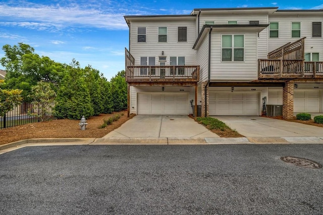 4565 Sims Park Ovlk, Suwanee, GA 30024 - townhome / multi-family property with a garage, fence, concrete driveway, and central AC