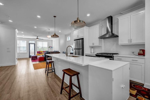 4565 Sims Park Ovlk, Suwanee, GA 30024 - kitchen featuring wall chimney exhaust hood, appliances with stainless steel finishes, a sink, plenty of natural light, and recessed lighting
