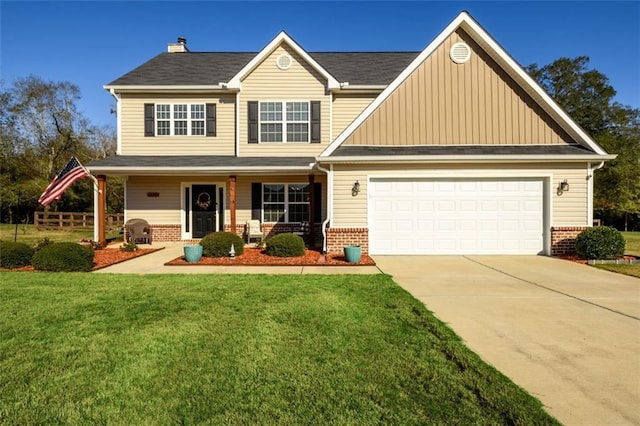 craftsman house with a garage, a front yard, concrete driveway, and brick siding