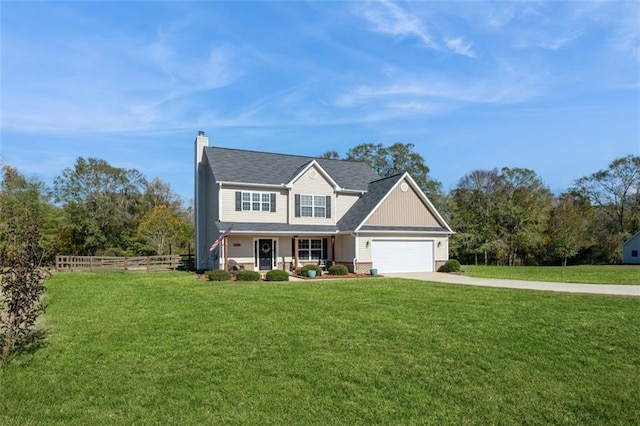 view of front facade featuring driveway, a front lawn, a chimney, and fence