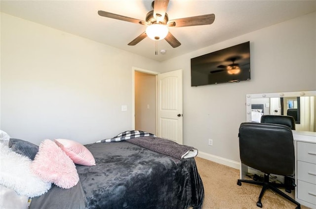 bedroom with light carpet, ceiling fan, and baseboards