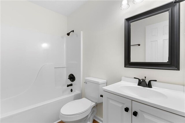 full bathroom with vanity, shower / bath combination, and toilet