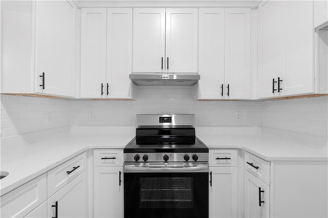 kitchen featuring white cabinets, backsplash, and stainless steel range