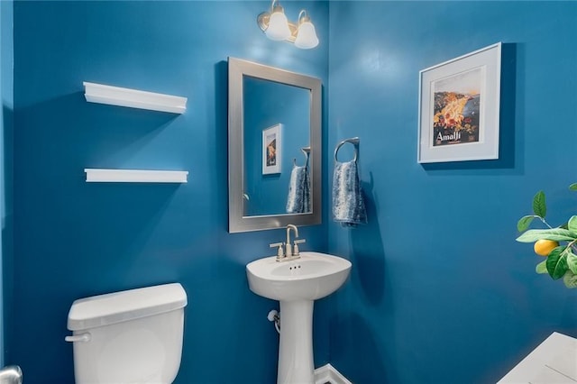 bathroom with sink and toilet