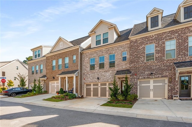 townhome / multi-family property featuring a garage