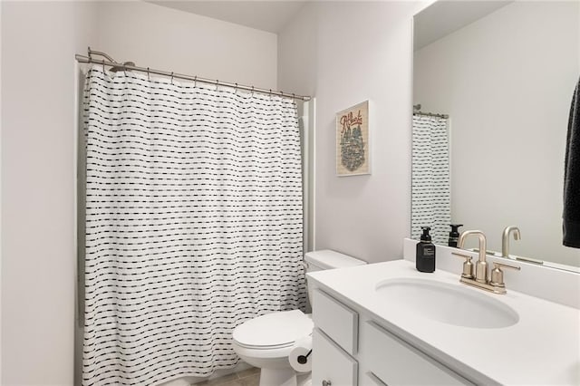 bathroom featuring vanity, walk in shower, toilet, and tile patterned flooring