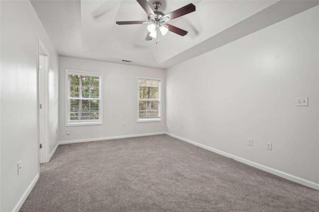 empty room featuring carpet floors and ceiling fan