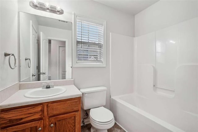 full bathroom with shower / washtub combination, vanity, and toilet