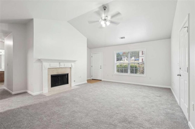 unfurnished living room with ceiling fan, light carpet, and vaulted ceiling