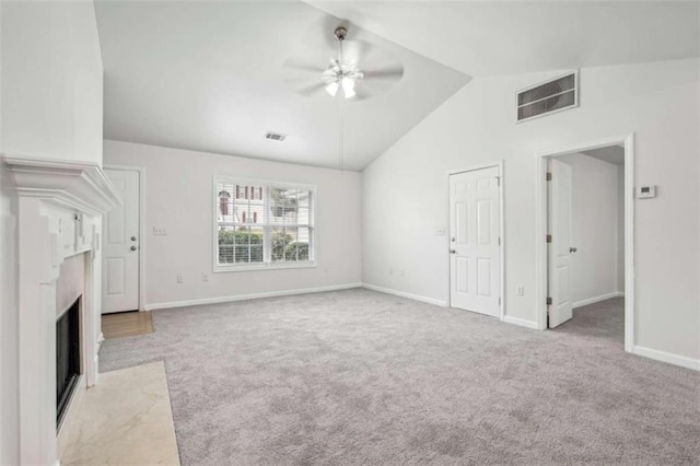 unfurnished living room with ceiling fan, light carpet, and high vaulted ceiling