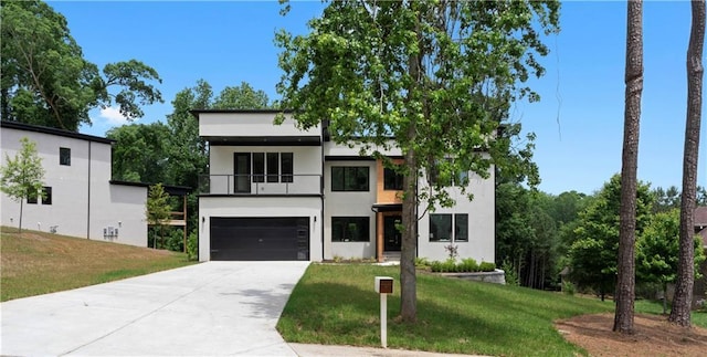 1610 Niskey Lake Rd, Atlanta, GA 30331 - modern home with a balcony, a garage, concrete driveway, a front lawn, and stucco siding