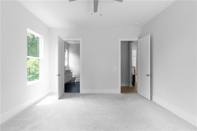 1610 Niskey Lake Rd, Atlanta, GA 30331 - unfurnished bedroom featuring carpet flooring, connected bathroom, baseboards, and ceiling fan
