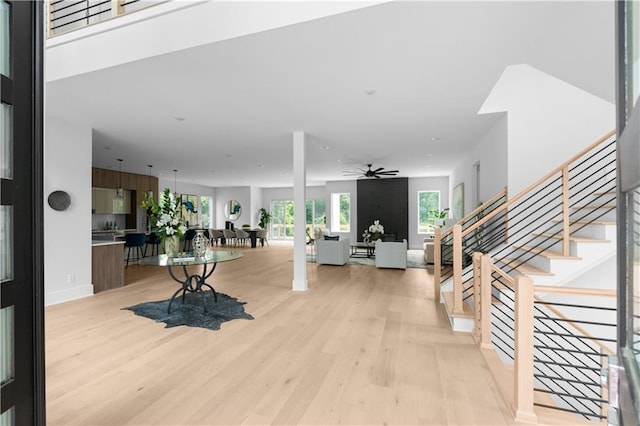 1610 Niskey Lake Rd, Atlanta, GA 30331 - living room featuring a ceiling fan, light wood-type flooring, stairway, and baseboards