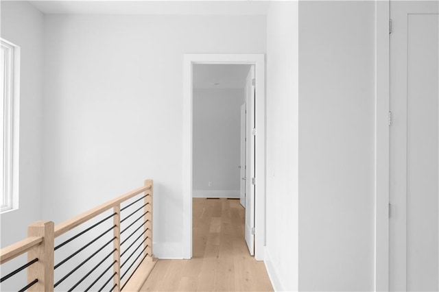 1610 Niskey Lake Rd, Atlanta, GA 30331 - hallway with an upstairs landing, light wood-style flooring, and baseboards