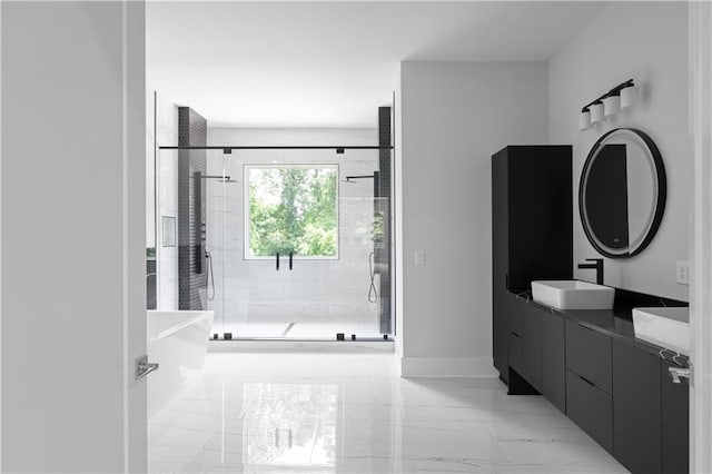 1610 Niskey Lake Rd, Atlanta, GA 30331 - bathroom featuring marble look tile flooring, double vanity, a stall shower, a freestanding tub, and baseboards