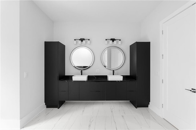 1610 Niskey Lake Rd, Atlanta, GA 30331 - bathroom featuring marble look tile flooring, double vanity, and baseboards