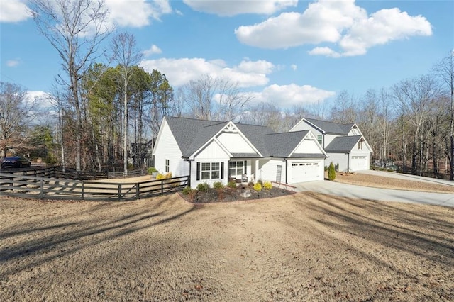 view of front of property with a front yard and a garage