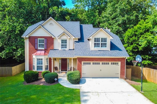 view of front of home featuring a garage and a front lawn