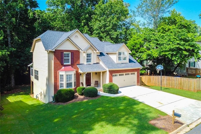 view of front of property with a garage and a front yard