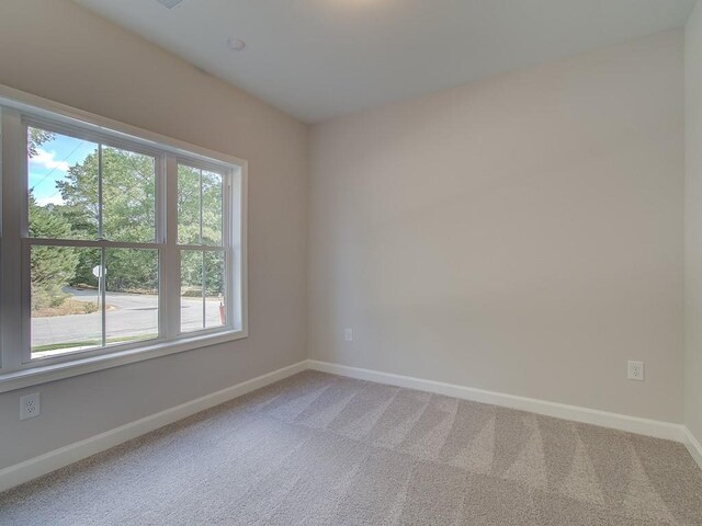 view of front of property with a garage and central AC