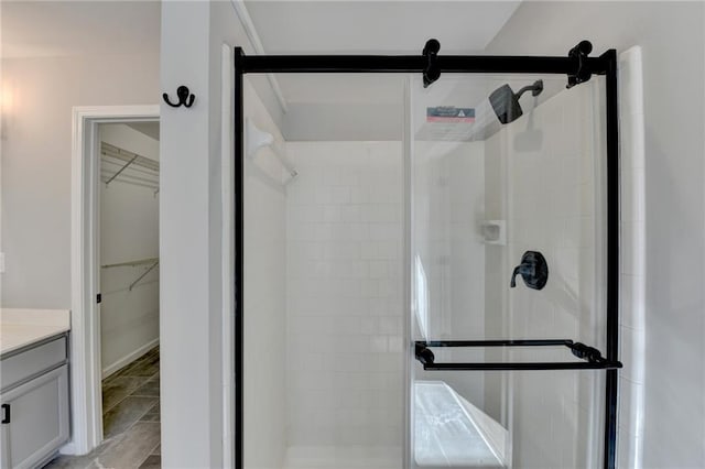 bathroom with vanity and an enclosed shower