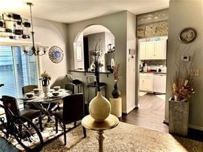 dining space featuring a chandelier and hardwood / wood-style flooring