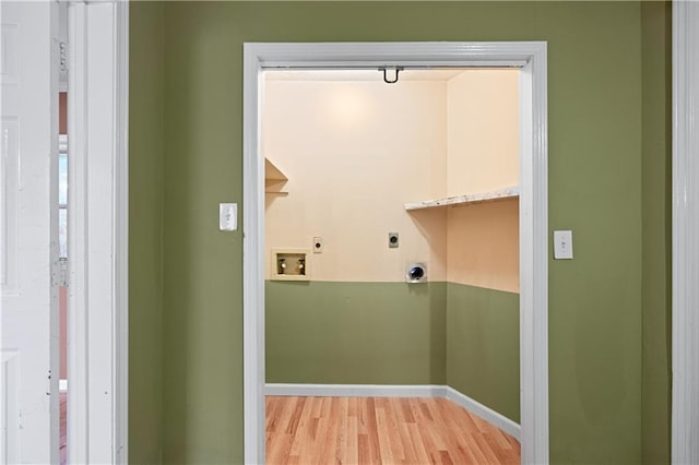 laundry room with hookup for a washing machine, electric dryer hookup, and light hardwood / wood-style floors