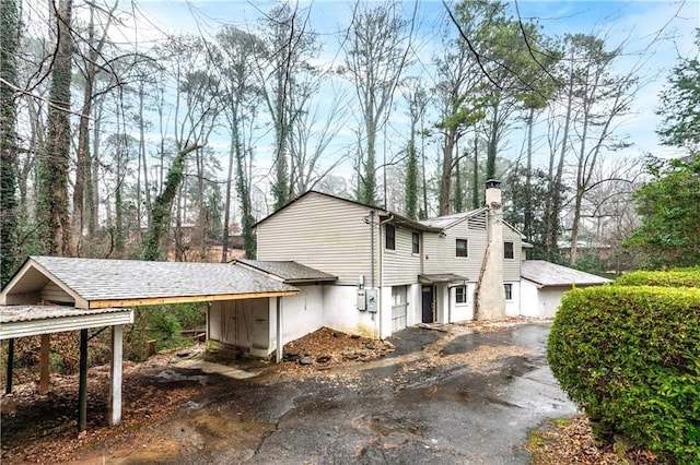 view of side of home with a garage