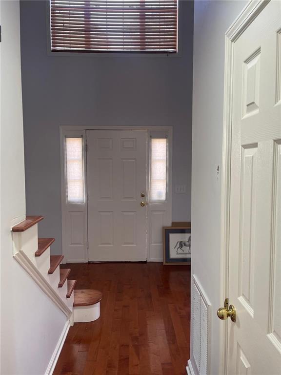 foyer featuring dark hardwood / wood-style floors