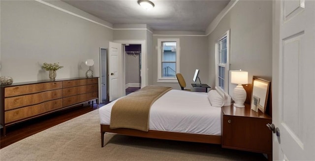 bedroom featuring a closet and wood finished floors