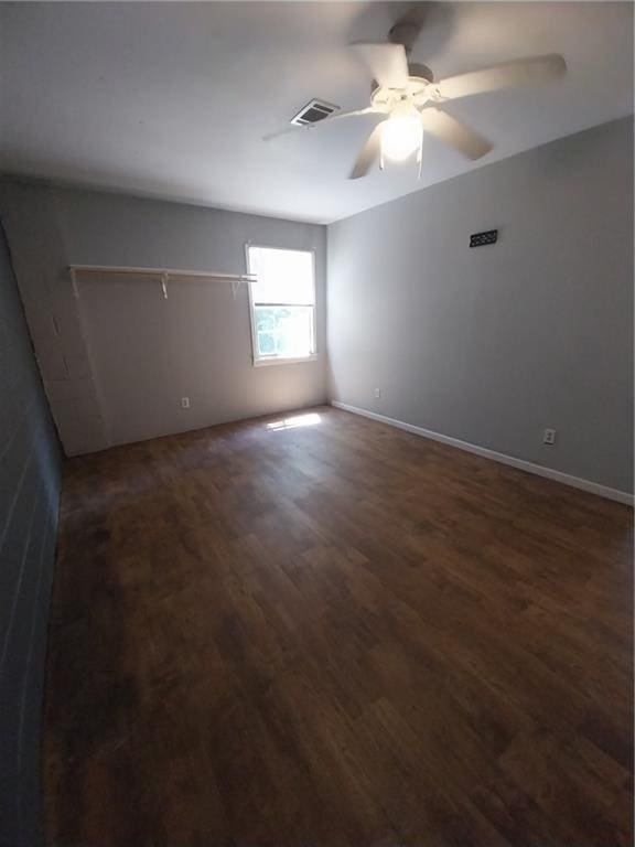6005 Hendrix Rd, Cumming, GA 30040 - unfurnished room with dark wood-type flooring and a ceiling fan