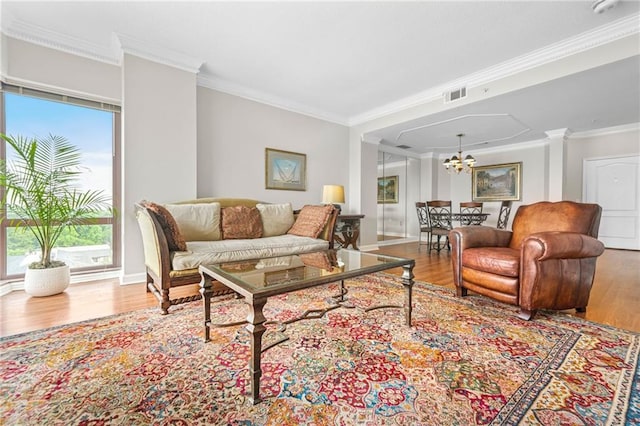 3475 Oak Valley Rd NE Unit 950, Atlanta, GA 30326 - living area with a chandelier, wood finished floors, crown molding, and baseboards