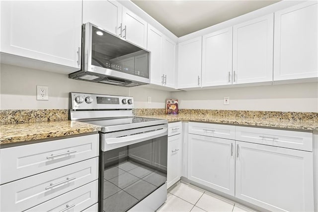 3475 Oak Valley Rd NE Unit 950, Atlanta, GA 30326 - kitchen with stainless steel appliances, light tile patterned floors, white cabinets, and light stone counters