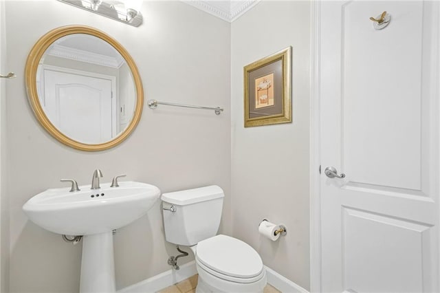 3475 Oak Valley Rd NE Unit 950, Atlanta, GA 30326 - bathroom featuring toilet, baseboards, and crown molding