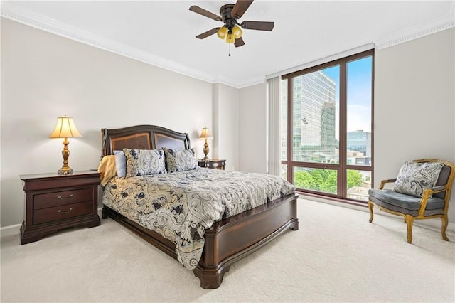 3475 Oak Valley Rd NE Unit 950, Atlanta, GA 30326 - bedroom with light colored carpet, multiple windows, crown molding, and a ceiling fan