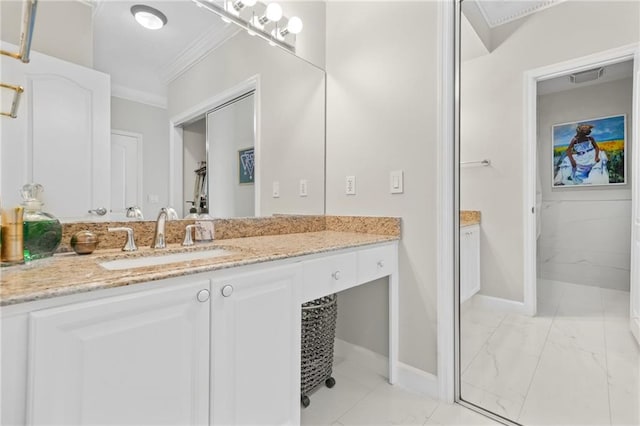 3475 Oak Valley Rd NE Unit 950, Atlanta, GA 30326 - bathroom featuring ornamental molding, marble look tile flooring, vanity, and baseboards