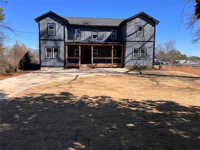 rear view of house with a porch